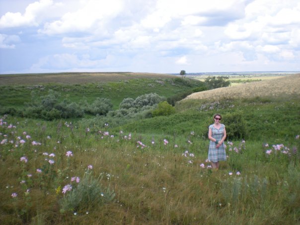Arkansas blogger, Amy, on the Siberian Steppe - a field of flowers