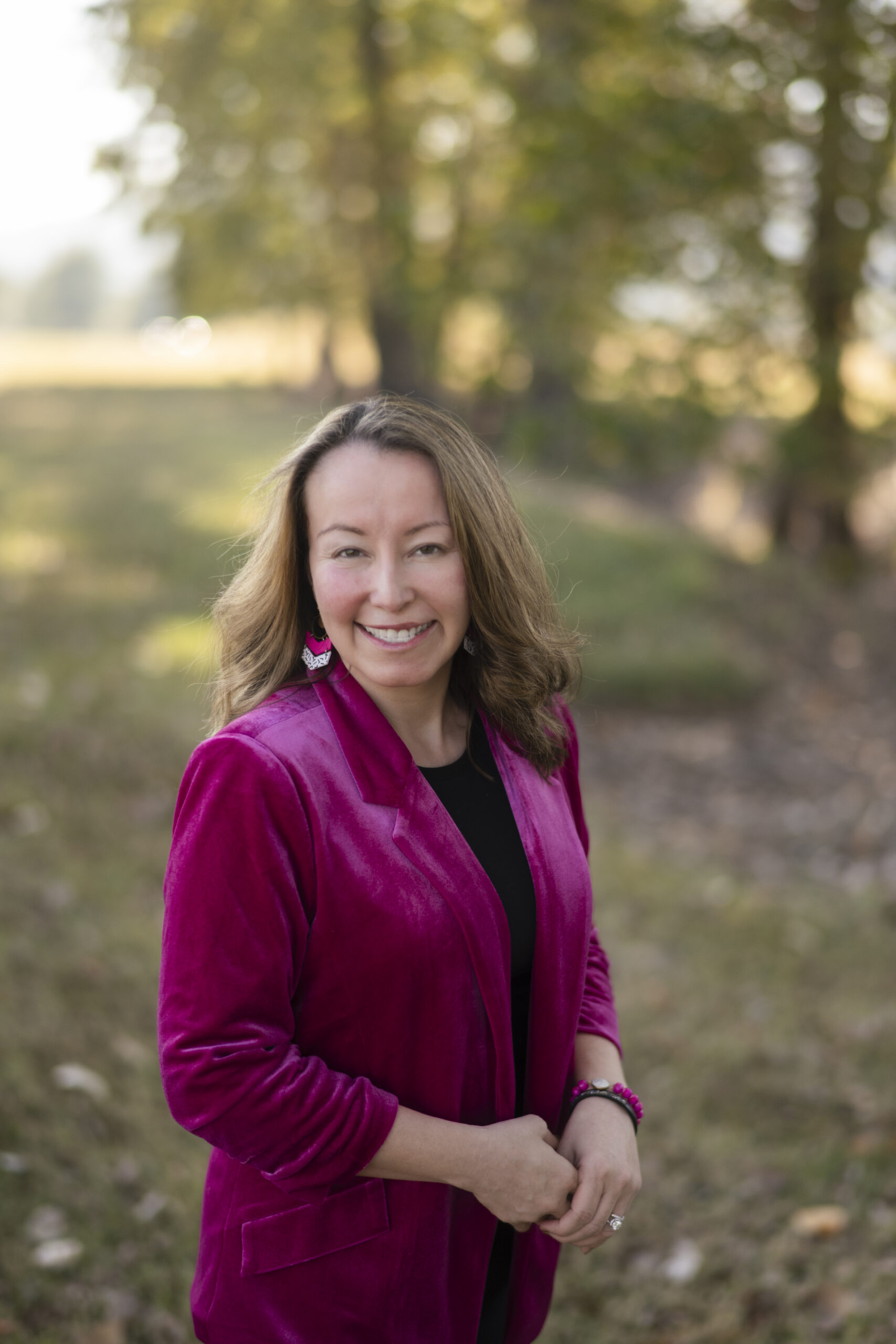 Arkansas ESL teacher, Amy Gramlich poses in pink blazer