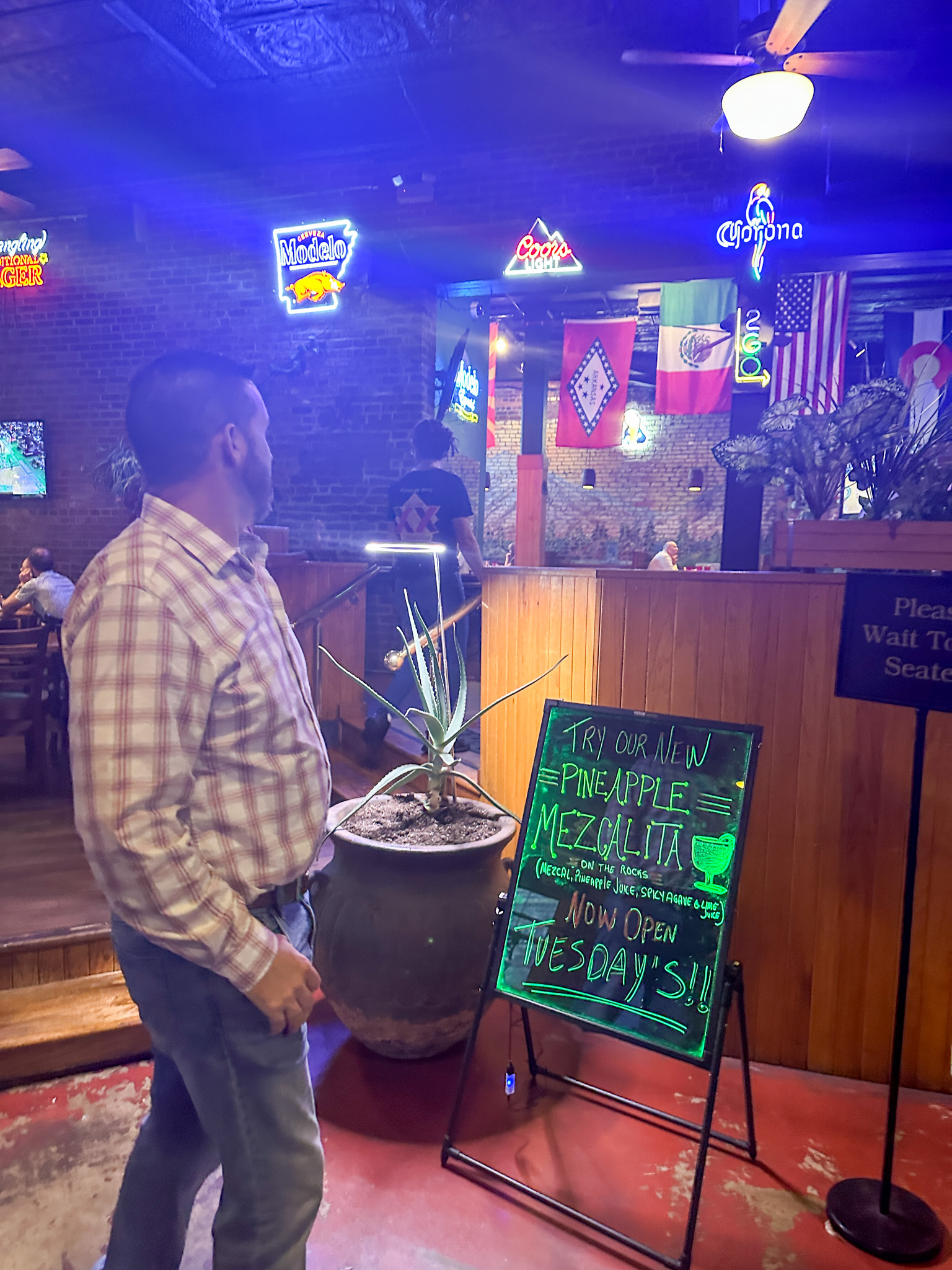 man waiting to be greeted and seated at Colorado Grill in Hot Springs